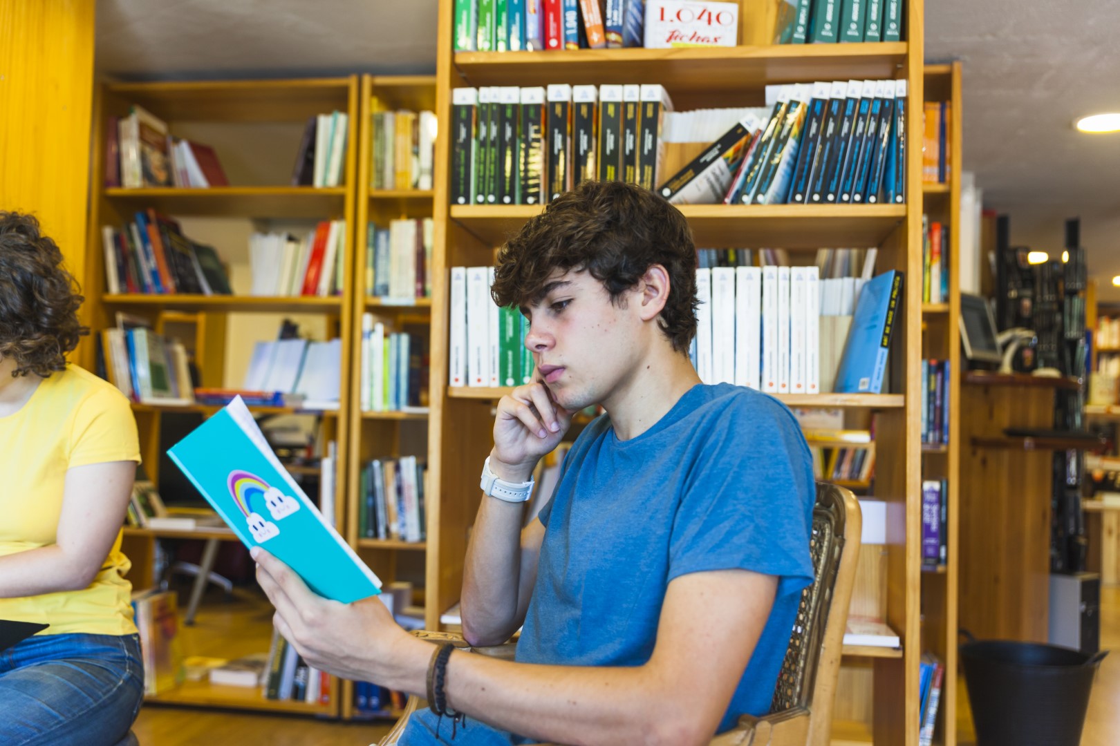 thoughtful-teenager-reading-library